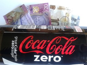 Coca Cola bottle and Cash