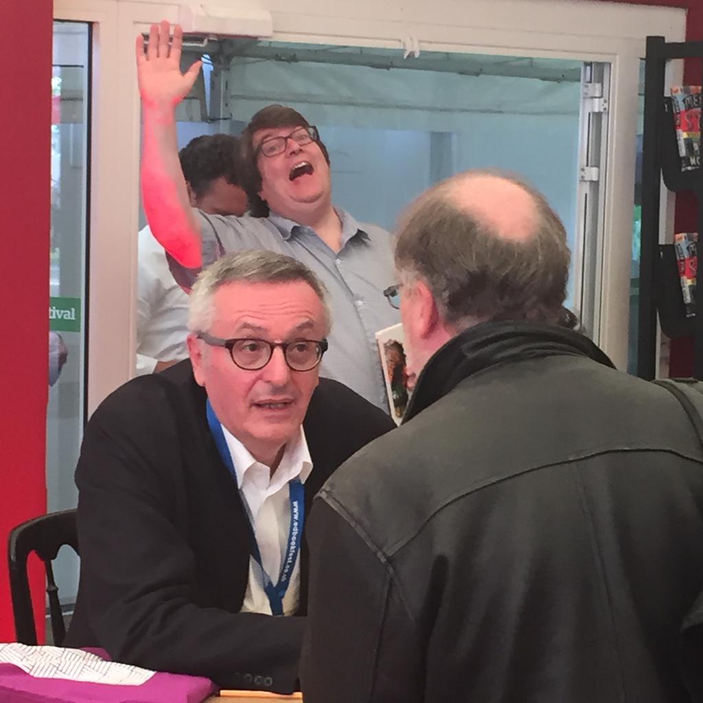 Philosopher, writer and critic of Progressivism and Labour, John Gray, being 'photobombed' at the 2015 Edinburgh International Book Festival.